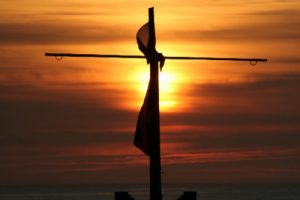 1274025215-Sunset_and_the_cross